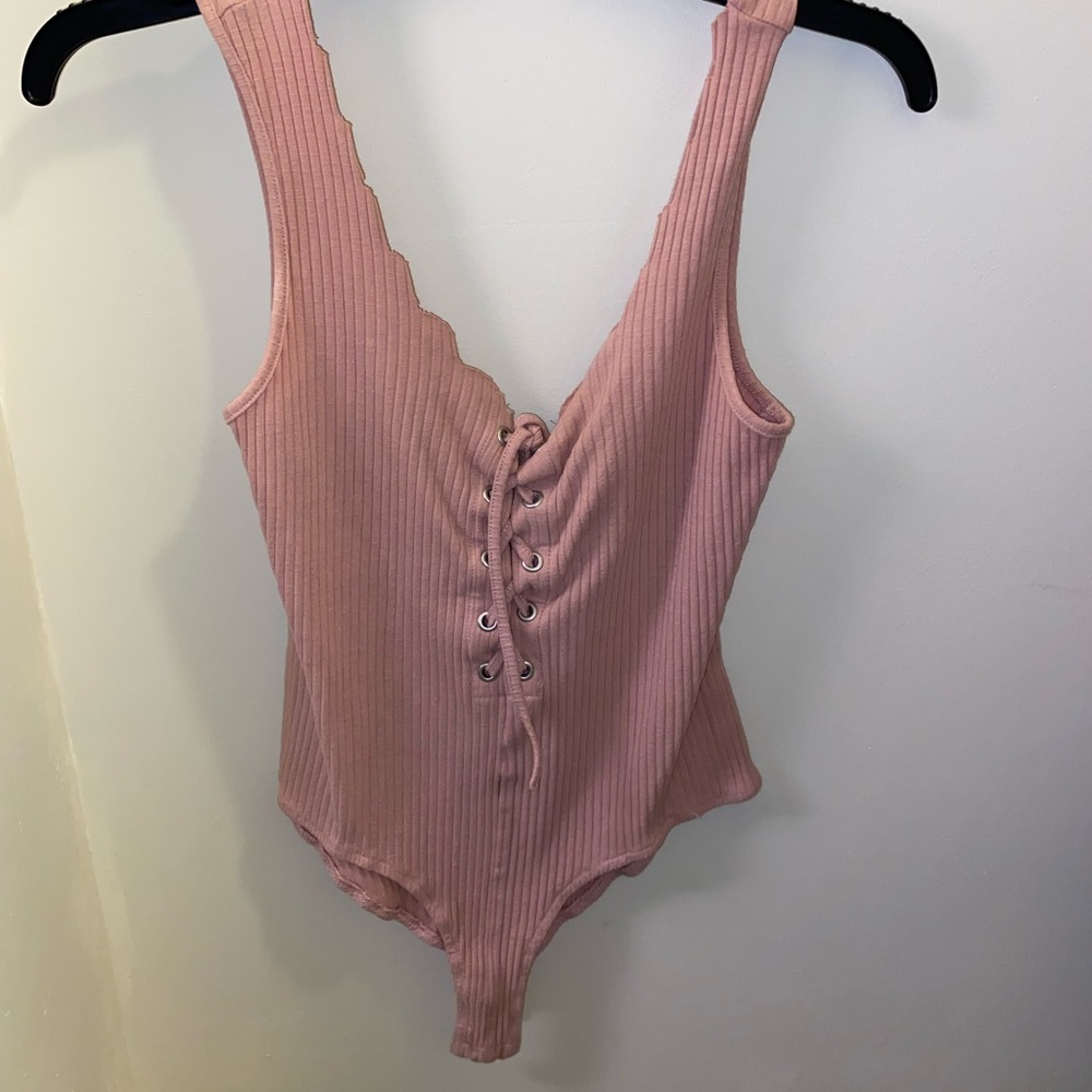 Small pink body suit Charlotte Russe